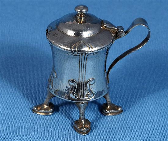 An Edwardian Arts and Crafts Cymric silver mustard pot, designed by Archibald Knox, for Liberty & Co, numbered 409, height 70mm,